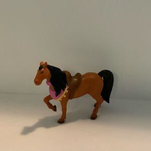 Beautiful Regal Horse with saddle and pink & yellow wrap.